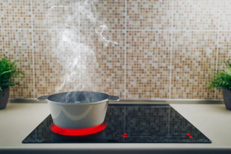 Steaming pot on a glass cooktop